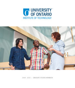 An image of the cover of the 2014-2015 Graduate Studies yearbook for UOIT. The cover photograph features a diverse group of three graduate students talking inside a modern campus building.