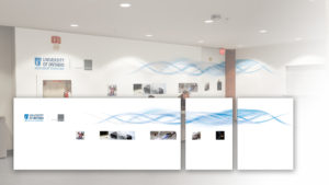 A mock up of large wall graphic in an office lobby area of the university's ACE wind tunnel facility, with three panels wrapping around a corner wall section.